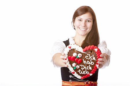 simsearch:400-07087495,k - Bavarian woman in love holds Oktoberfest heart. Isolated on white background. Stock Photo - Budget Royalty-Free & Subscription, Code: 400-04689841