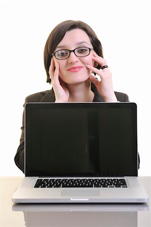 one young business woman isolated on white working on laptop computer Stock Photo - Budget Royalty-Free & Subscription, Code: 400-04680004