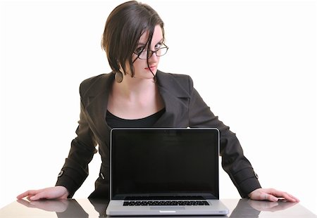 simsearch:400-05209692,k - one young business woman isolated on white working on laptop computer Stock Photo - Budget Royalty-Free & Subscription, Code: 400-04680009