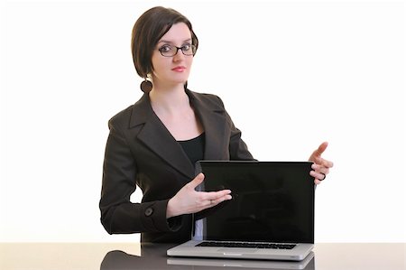 one young business woman isolated on white working on laptop computer Stock Photo - Budget Royalty-Free & Subscription, Code: 400-04680002