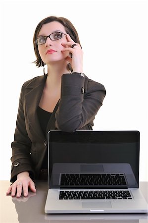 one young business woman isolated on white working on laptop computer Stock Photo - Budget Royalty-Free & Subscription, Code: 400-04680011