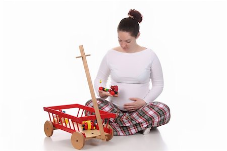 simsearch:400-04859723,k - pregnant woman and toys on white background Fotografie stock - Microstock e Abbonamento, Codice: 400-04680078