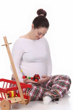 simsearch:400-04859723,k - pregnant woman and toys on white background Fotografie stock - Microstock e Abbonamento, Codice: 400-04680079
