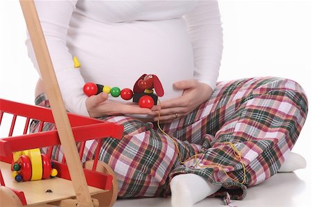 simsearch:400-04859723,k - pregnant woman and toys on white background Fotografie stock - Microstock e Abbonamento, Codice: 400-04680084