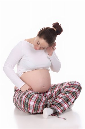 simsearch:400-04582878,k - pregnant woman looking belly on white background Foto de stock - Super Valor sin royalties y Suscripción, Código: 400-04680082