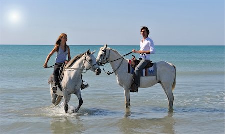 simsearch:400-04660370,k - father and daughter with arabian and camargue horses in the sea with an evening sun Photographie de stock - Aubaine LD & Abonnement, Code: 400-04680152