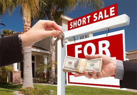 eviction - Handing Over Cash For House Keys and Short Sale Real Estate Sign in Front of Home. Stock Photo - Budget Royalty-Free & Subscription, Code: 400-04680206