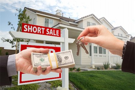 eviction - Handing Over Cash For House Keys and Short Sale Real Estate Sign in Front of Home. Stock Photo - Budget Royalty-Free & Subscription, Code: 400-04680211