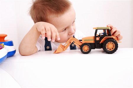 simsearch:400-04161658,k - Portrait of lovely boy playing with toys with copy space Fotografie stock - Microstock e Abbonamento, Codice: 400-04680229