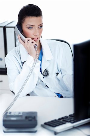 doctor speaking to young patient - Attractive female doctor making phone call with the patient, white background studio shot Stock Photo - Budget Royalty-Free & Subscription, Code: 400-04680653