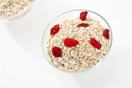porridge and berries - food series: oatmeal porridge flakes decorated with strawberry Stock Photo - Budget Royalty-Free & Subscription, Code: 400-04680684