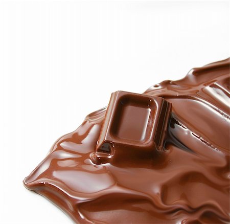 simsearch:400-06397215,k - Melting piece of dark chocolate on white background Photographie de stock - Aubaine LD & Abonnement, Code: 400-04680948
