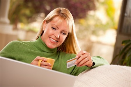 Beautiful Woman with Credit Card Using Her Laptop. Stock Photo - Budget Royalty-Free & Subscription, Code: 400-04681009