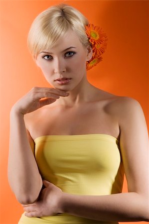 simsearch:400-08116534,k - blond and cute girl with some flowers in her hair on orange and yellow color Stock Photo - Budget Royalty-Free & Subscription, Code: 400-04681144