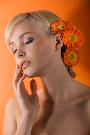 simsearch:400-08116534,k - young beauty blond girl with closed eyes as dreaming with orange gerbera in hair Stock Photo - Budget Royalty-Free & Subscription, Code: 400-04681147