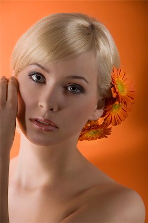 simsearch:400-08116534,k - young beauty sweet blond girl with wuth gerbera in hair looking in camera Stock Photo - Budget Royalty-Free & Subscription, Code: 400-04681148