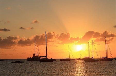 Colorful sunset in the Caribbean over ocean Stockbilder - Microstock & Abonnement, Bildnummer: 400-04681183