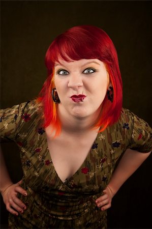 simsearch:400-06330521,k - Pretty punky girl with brightly dyed red hair Photographie de stock - Aubaine LD & Abonnement, Code: 400-04681319