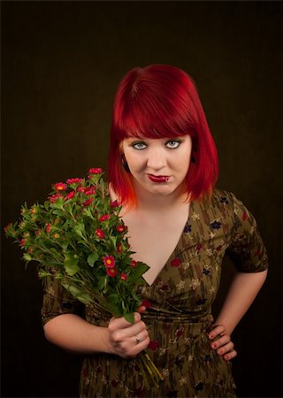 simsearch:400-06330521,k - Pretty punky girl with brightly dyed red hair and flowers Photographie de stock - Aubaine LD & Abonnement, Code: 400-04681320