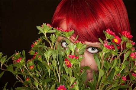 simsearch:400-06330521,k - Pretty punky girl with brightly dyed red hair and flowers Photographie de stock - Aubaine LD & Abonnement, Code: 400-04681321