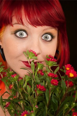simsearch:400-06330521,k - Pretty punky girl with brightly dyed red hair and flowers Photographie de stock - Aubaine LD & Abonnement, Code: 400-04681322
