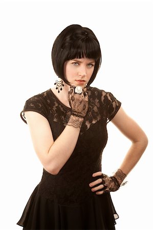 simsearch:400-04681336,k - Retro woman with black hair and Parisian 1950s dress Stock Photo - Budget Royalty-Free & Subscription, Code: 400-04681337