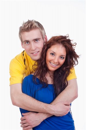 simsearch:400-04702706,k - happy young couple - boy embracing girl, smiling - isolated on white Stockbilder - Microstock & Abonnement, Bildnummer: 400-04682341