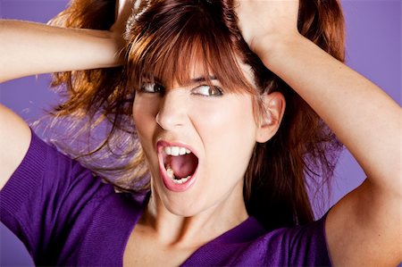 simsearch:400-04925223,k - Beautiful woman with a angry expression pulling her hair Stock Photo - Budget Royalty-Free & Subscription, Code: 400-04683130