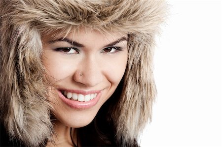 simsearch:400-06105120,k - Adorable young woman smiling with a fur hat Fotografie stock - Microstock e Abbonamento, Codice: 400-04683160