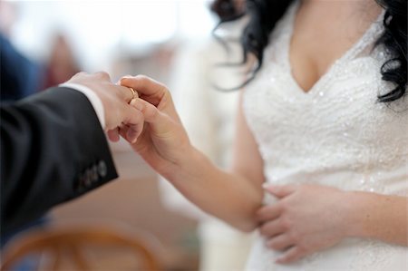 Bride is putting the ring on groom's finger Stock Photo - Budget Royalty-Free & Subscription, Code: 400-04683836