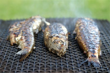 Three trout on grill. Shallow dof, copy space Stock Photo - Budget Royalty-Free & Subscription, Code: 400-04683876