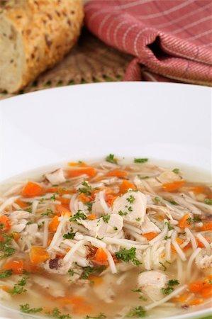 simsearch:400-07481067,k - Chicken soup with pieces of meat, carrot, noodles and parsley Stock Photo - Budget Royalty-Free & Subscription, Code: 400-04683871