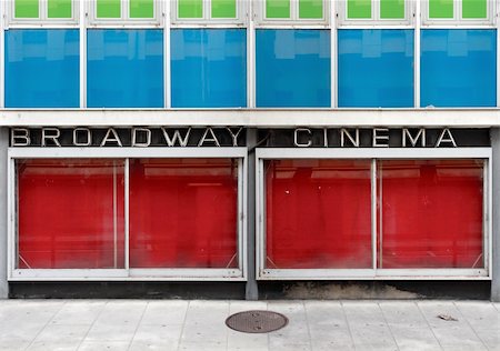 The old facade of an abandoned cinema with neon lights and empty display windows. Stock Photo - Budget Royalty-Free & Subscription, Code: 400-04694185