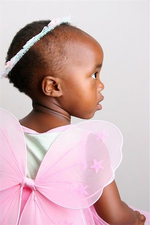 Toddler girl in a pink fairy costume with wings and head piece Photographie de stock - Aubaine LD & Abonnement, Code: 400-04694816