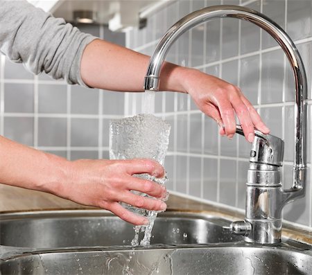 simsearch:400-05291556,k - Human filling a glass of water Stock Photo - Budget Royalty-Free & Subscription, Code: 400-04695043