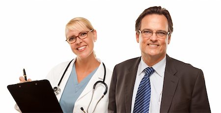 Smiling Businessman with Female Doctor or Nurse with Clipboard Isolated on a White Background. Stock Photo - Budget Royalty-Free & Subscription, Code: 400-04695254