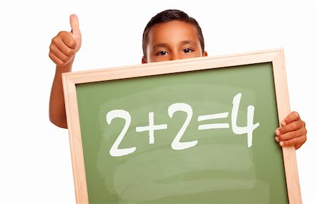simsearch:400-04125503,k - Proud Hispanic Boy Holding Chalkboard with Math Equation and Thumbs Up Isolated on a White Background. Photographie de stock - Aubaine LD & Abonnement, Code: 400-04695259