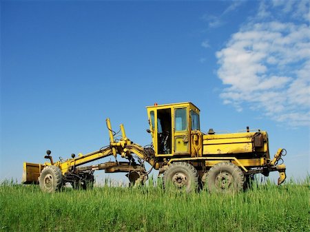 flattening - grader on the country road against blue sky Stock Photo - Budget Royalty-Free & Subscription, Code: 400-04695250