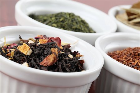 simsearch:400-05947571,k - White bowls with various kinds of tea - focus on black tea with flower petals and dried orange peel Stock Photo - Budget Royalty-Free & Subscription, Code: 400-04695327