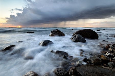 stormy beach scene - rocks at the beach on a windy day Stock Photo - Budget Royalty-Free & Subscription, Code: 400-04695615