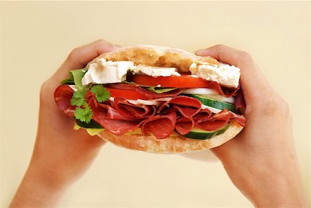 simsearch:400-04896913,k - appetizing big fresh sandwich with ham, cheese and vegetables in hands Stock Photo - Budget Royalty-Free & Subscription, Code: 400-04696265