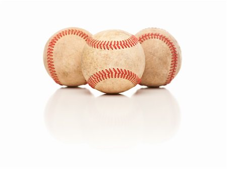 simsearch:400-04673387,k - Three Baseballs Isolated on a Reflective White Background. Stock Photo - Budget Royalty-Free & Subscription, Code: 400-04696275