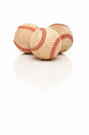 simsearch:400-04673387,k - Three Baseballs Isolated on a Reflective White Background. Photographie de stock - Aubaine LD & Abonnement, Code: 400-04696276