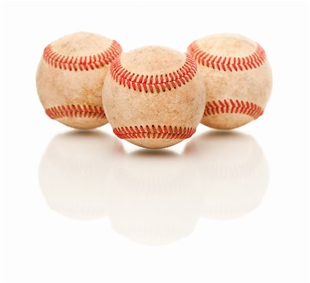 simsearch:400-04673387,k - Three Baseballs Isolated on a Reflective White Background. Photographie de stock - Aubaine LD & Abonnement, Code: 400-04696287