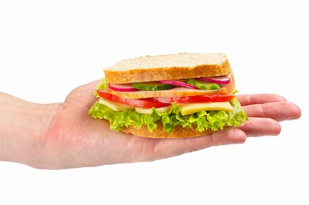 Sandwich with ham, tomato, radish, cucumber and cheese in the hand isolated over white background Fotografie stock - Microstock e Abbonamento, Codice: 400-04696606