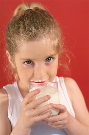 simsearch:400-05014700,k - girl drinking milk with milk mustache Fotografie stock - Microstock e Abbonamento, Codice: 400-04697033