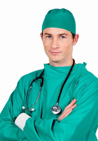 simsearch:400-04198266,k - Confident young surgeon with folded arms against a white background Stockbilder - Microstock & Abonnement, Bildnummer: 400-04697298