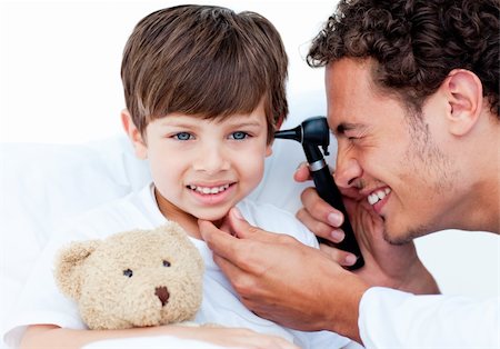 paediatrician (male) - Attractive doctor examining patient's ears at the hospital Stock Photo - Budget Royalty-Free & Subscription, Code: 400-04697304