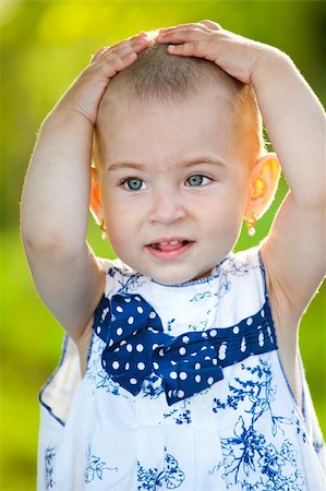 simsearch:400-06087517,k - Portrait of a small little girl with a funny expression. Stock Photo - Budget Royalty-Free & Subscription, Code: 400-04697356