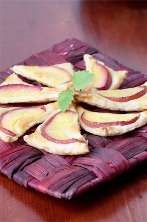 simsearch:400-04822787,k - Delicious puff pastry triangles with fresh nectarines Stock Photo - Budget Royalty-Free & Subscription, Code: 400-04698192